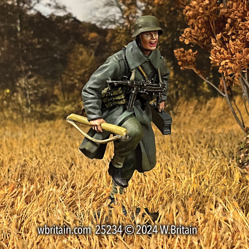 German Grenadier Running in Greatcoat With Spare MG 42 Barrel 1943-45